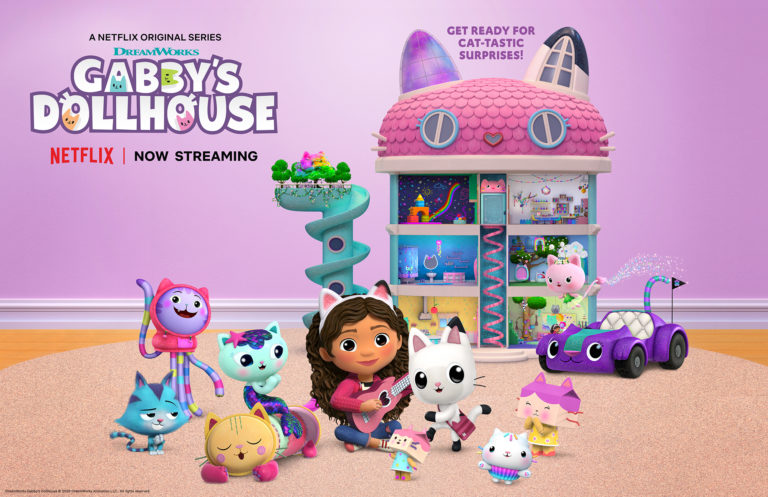 Characters from the Netflix show Gabby's Dollhouse in front of the dollhouse.