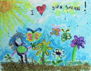 A child's drawing of a person, flowers, butterflies, soil, and sun with the words I (heart) sunshine