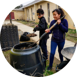 children removing compost from a compost bin