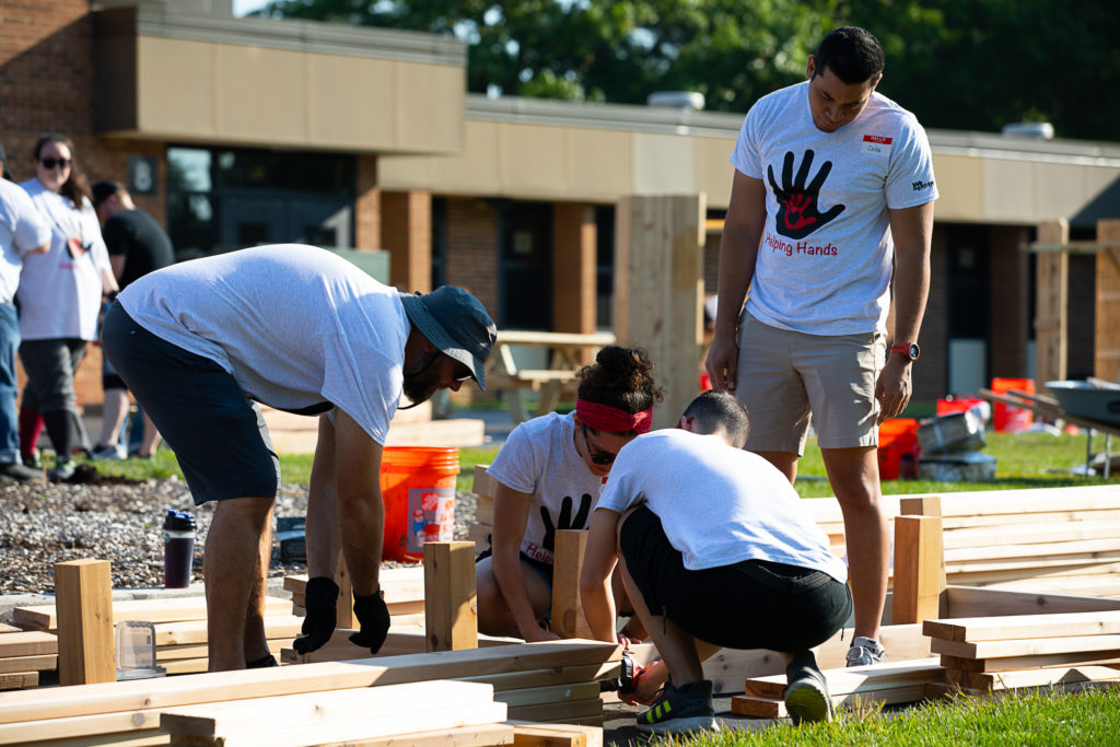 Volunteers building a raised bed