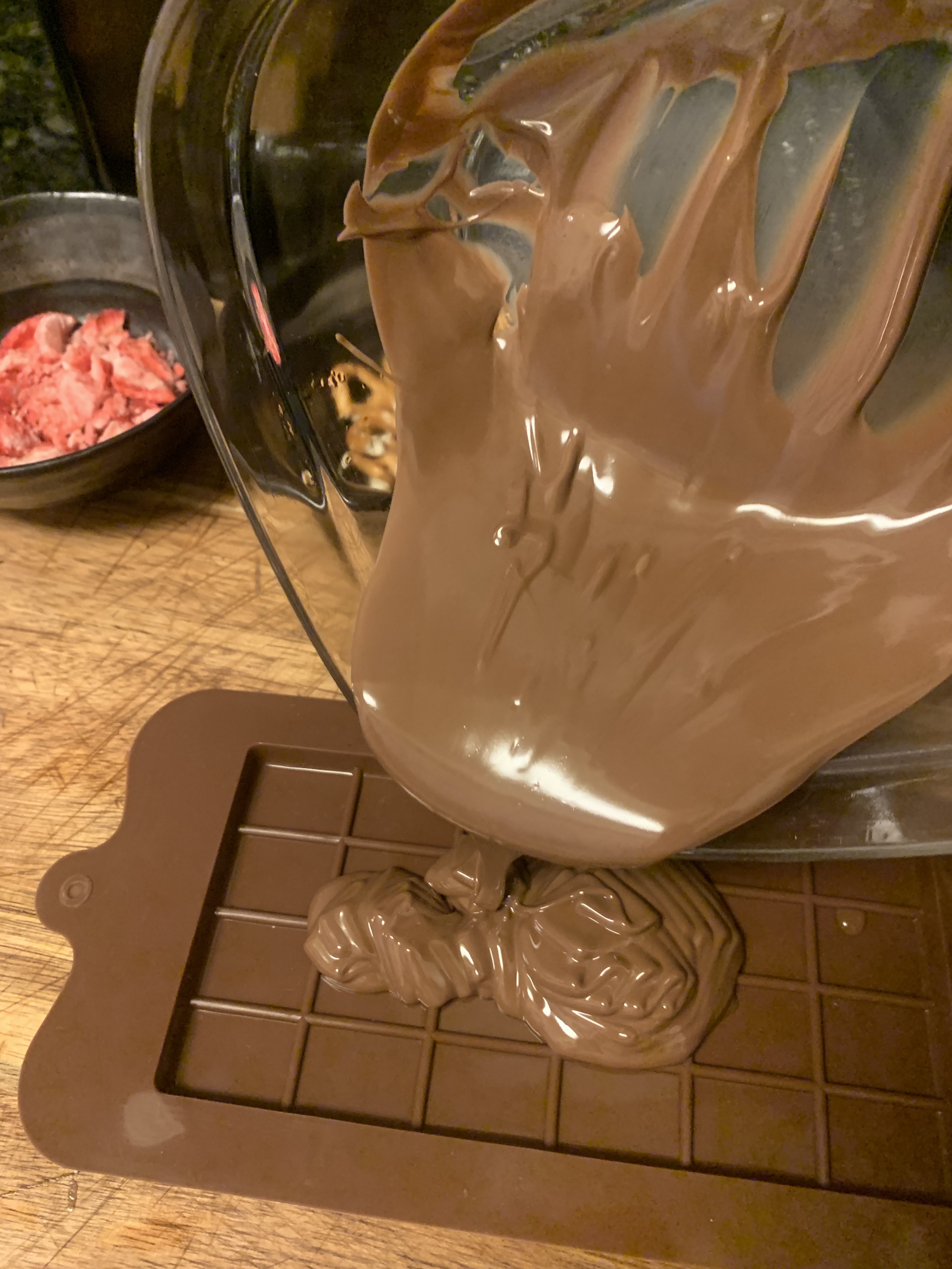 Melted chocolate being poured into a mold