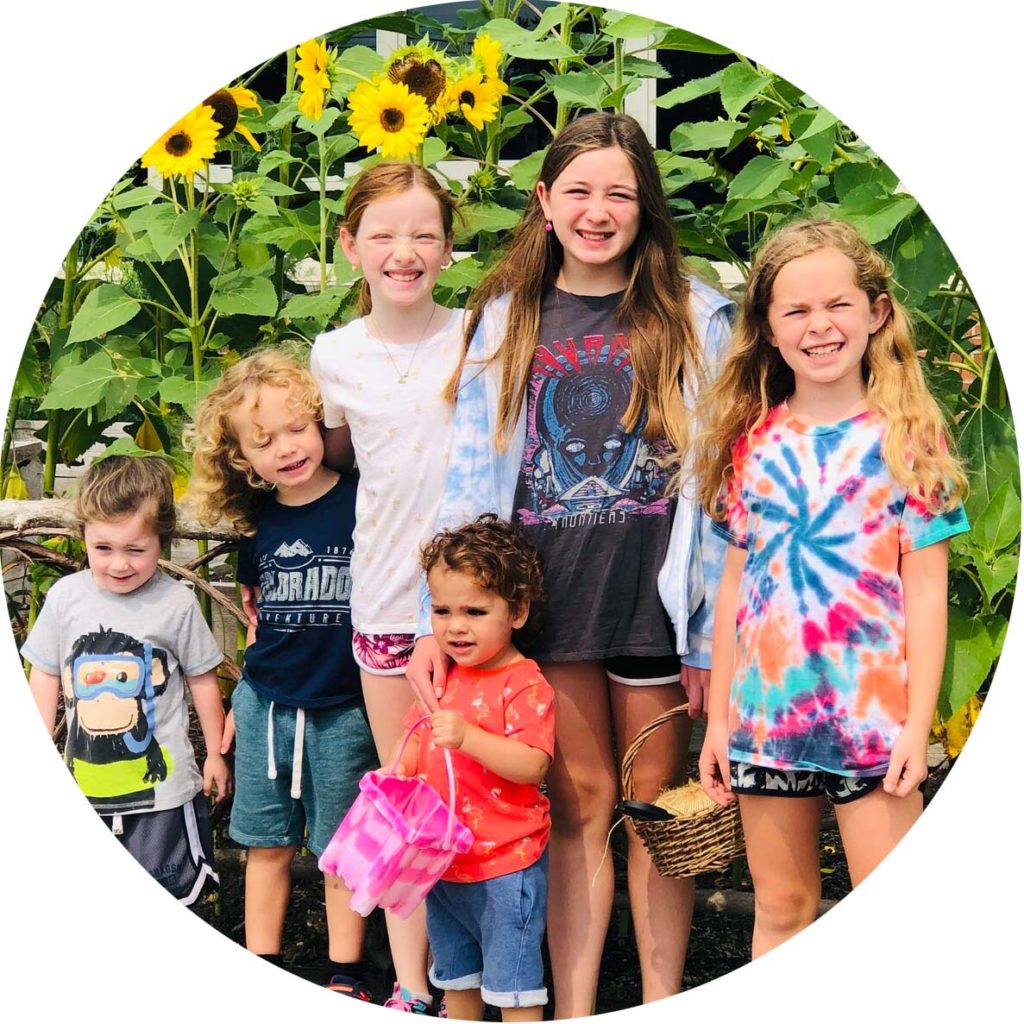 A group of kids in a range of ages and sizes