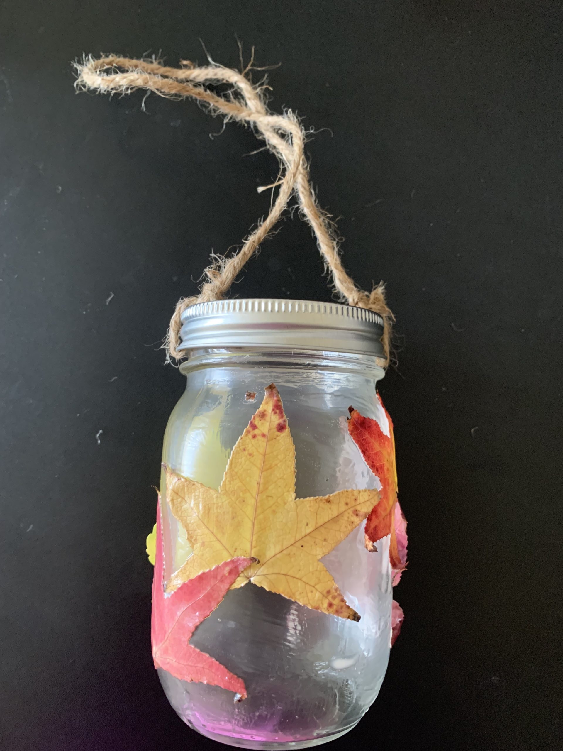 A mason jar with a twine handle