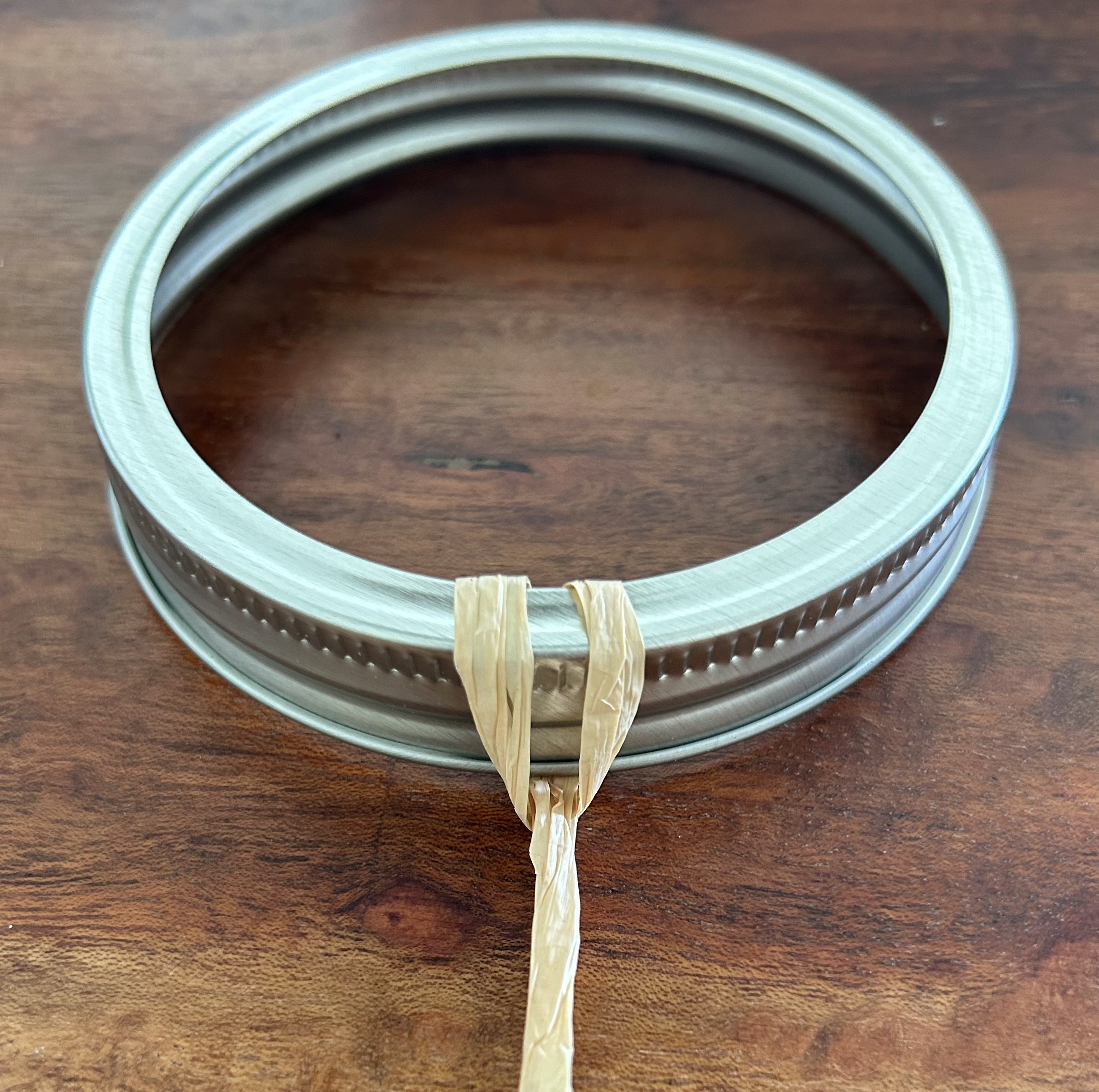 A ribbon attached to a jar lid